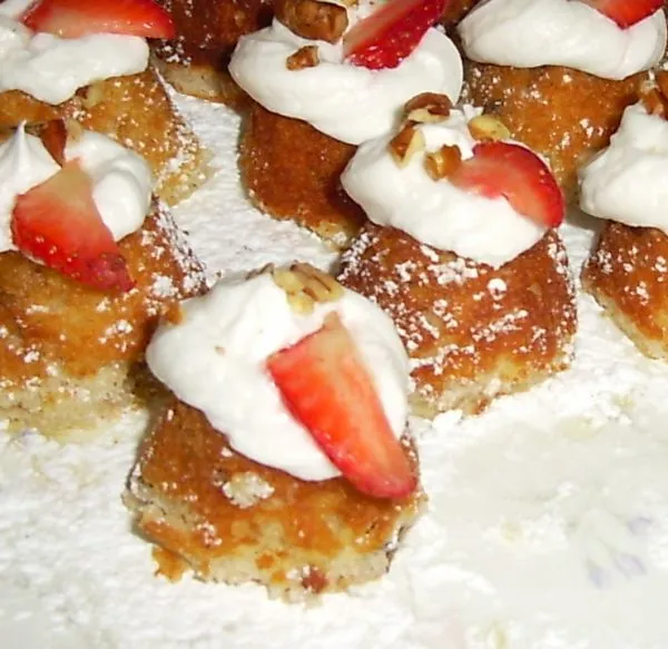 Mini size Italian wedding cake with strawberries and cream.